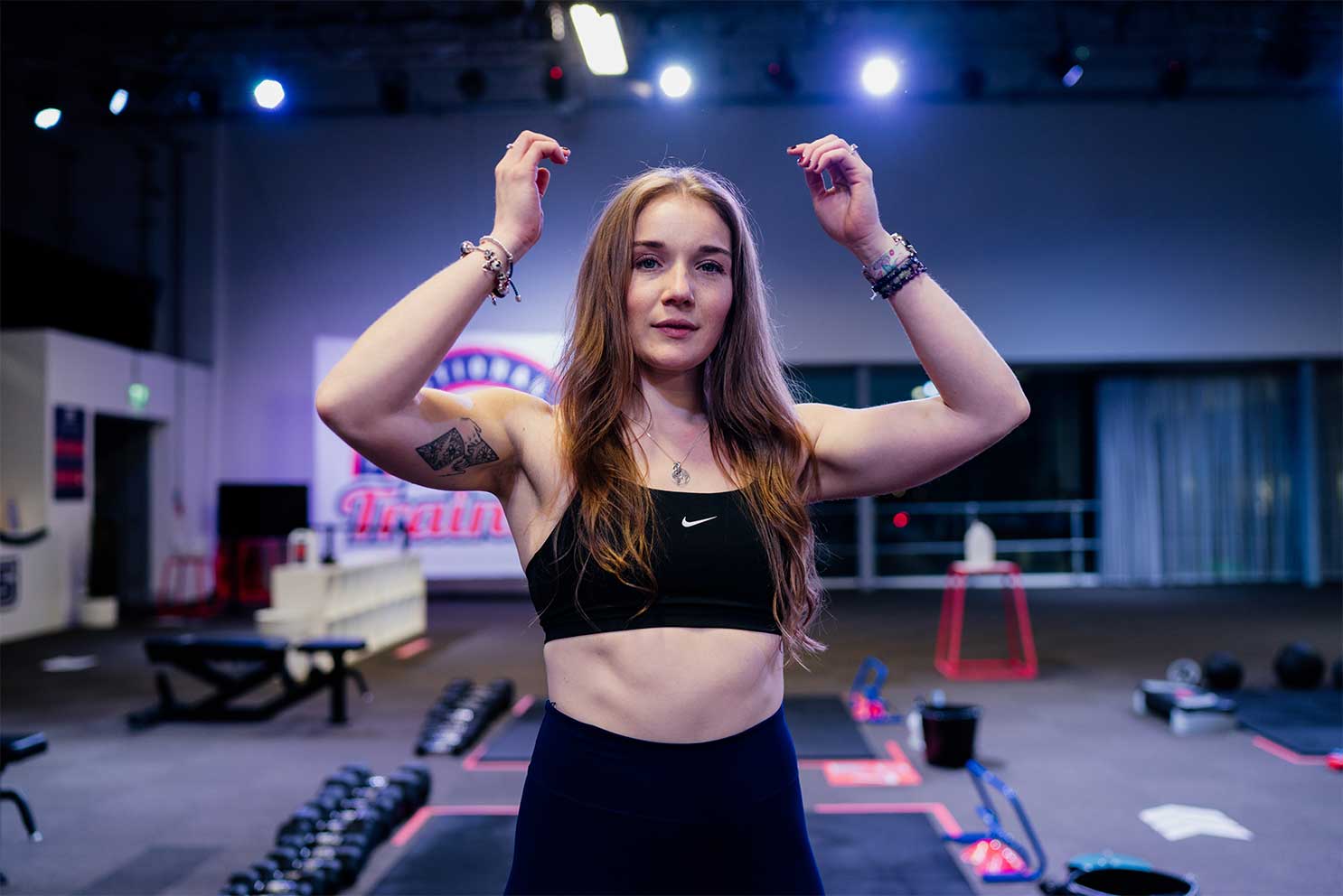 Coach is posing at the gym