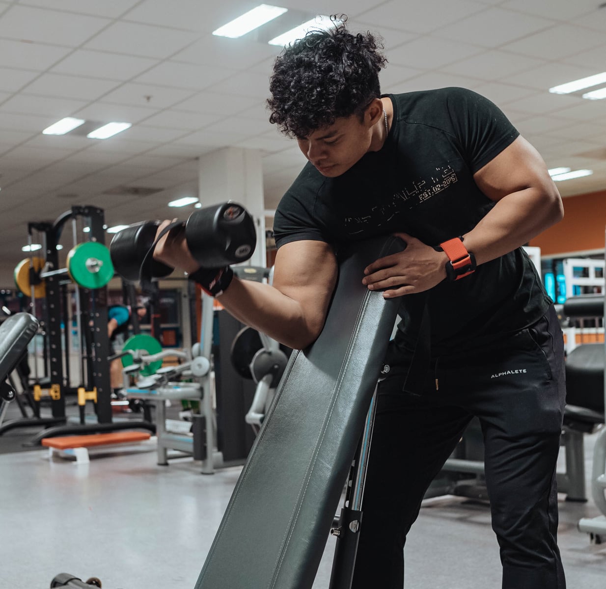 Coach is working out biceps.